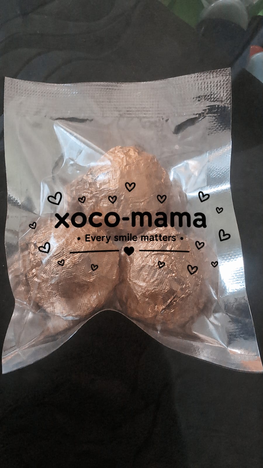 Three xoco-mama choco bites in rose-gold foil pouch